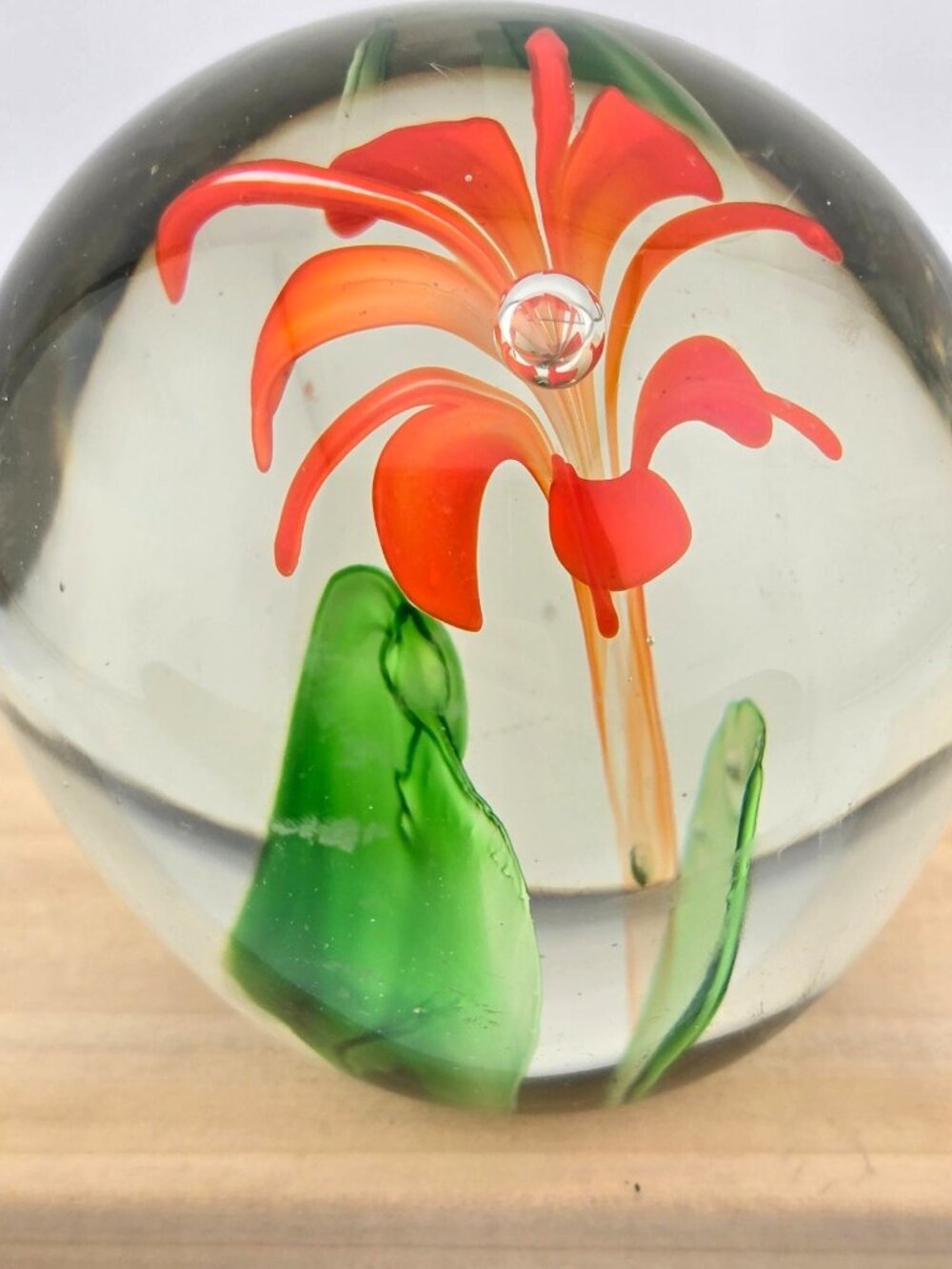 Handcrafted Clear Glass Paperweight With Orange Flower Design & Green Leaves - Picture 4 of 15